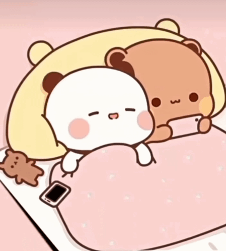 Two Teddy Bears on Bed with Phone
