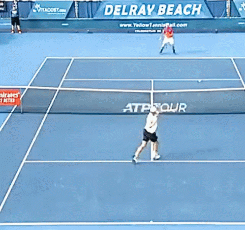 Two Tennis Players on Court With Delray Beach Banner