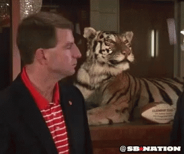 Two Texas A&M Football Players Talking on Field