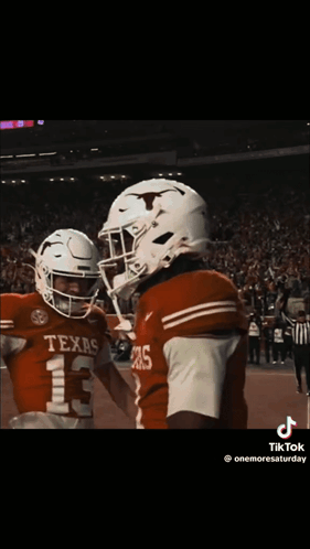 Two Texas Football Players Hugging