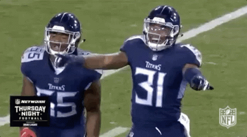 Two Titans Football Players Celebrating Touchdown