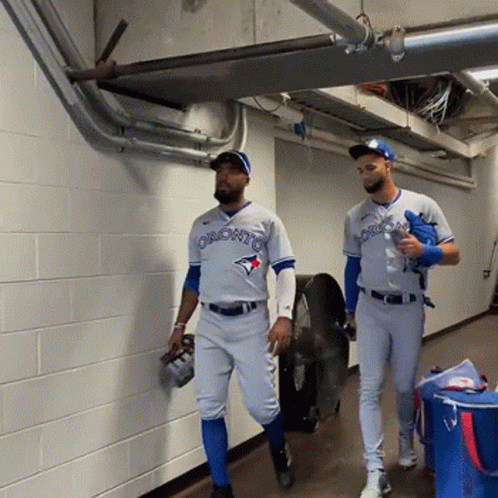 Two Toronto Blue Jays Baseball Players Walking