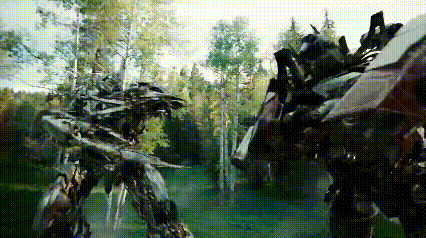 Two Transformers Are Fighting In A Forest With Trees In The Background GIF