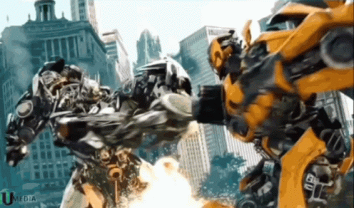 Two Transformers Fighting in Front of City With Umedia