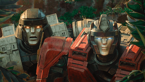 Two Transformers Standing With Glowing Eyes