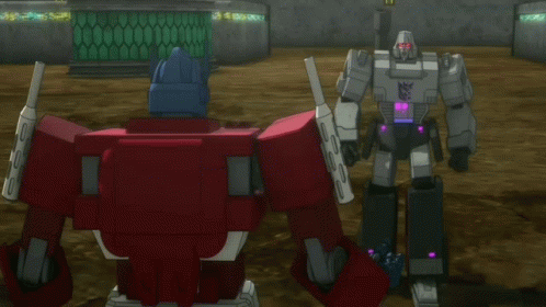 Two Transformers Standing With Text And Now Look At This Server
