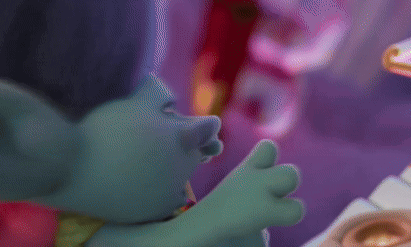 Two Trolls Are Standing Next To Each Other And One Has A Crown On His Head GIF