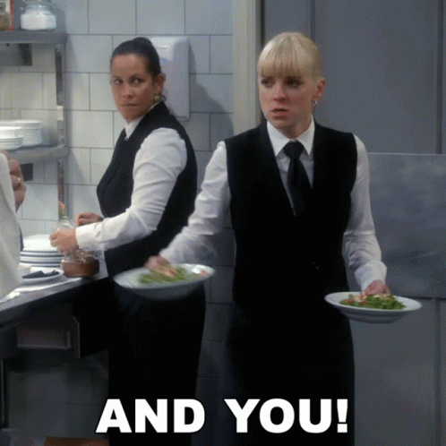 Two Waitresses Carrying Plates of Food