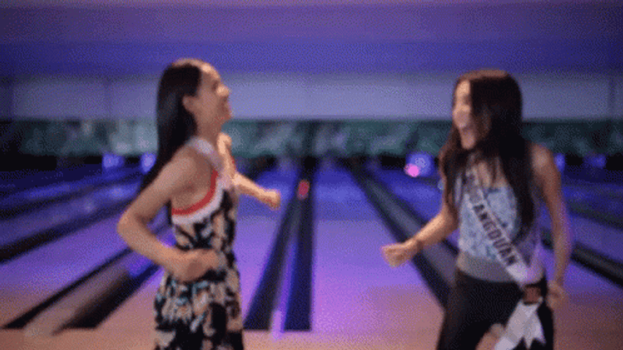Two Woman Laughing Bowling Alley GIF