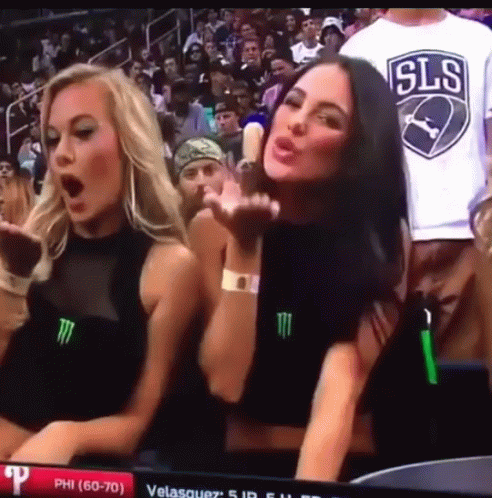 Two Women and Man in SLS Shirt Stadium