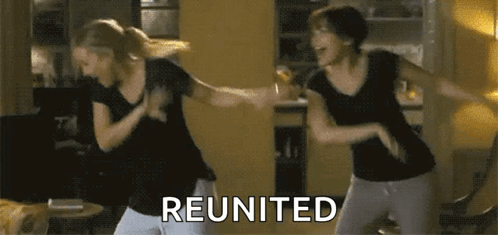 Two Women Are Dancing In A Living Room And The Word Reunited Is On The Bottom Right GIF
