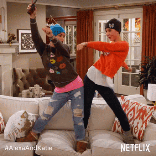 Two Women Dancing On Couch With Alexaandkatie Hashtag GIF