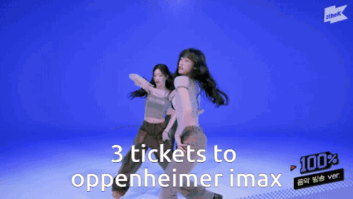 Two Women Are Dancing With The Words 3 Tickets To Oppenheimer Imax Behind Them GIF
