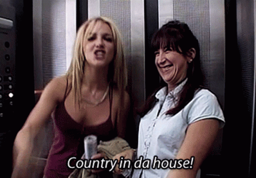 Two Women Are In An Elevator And One Of Them Is Saying " Country In Da House " GIF