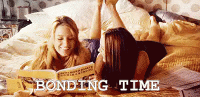 Two Women Reading On Bed Bonding Time GIF