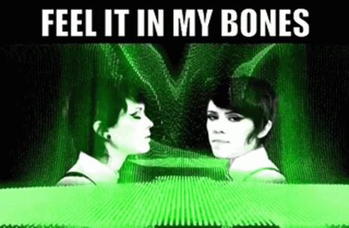 Two Women Are Looking At Each Other With The Words Feel It In My Bones Above Them GIF