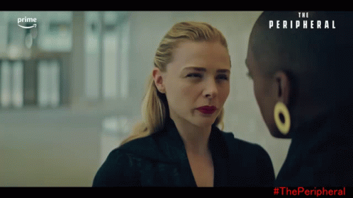 Two Women Are Looking At Each Other With The Words The Peripheral Behind Them GIF
