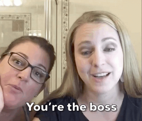 Two Women Are Posing For A Picture And One Of Them Says You 'Re The Boss GIF