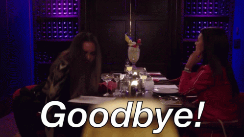 Two Women Are Sitting At A Table With The Words Goodbye Written On It GIF