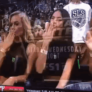 Two Women Watching Basketball In Stadium GIF