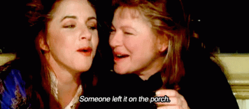 two women are sitting next to each other and one of them is saying someone left it on the porch