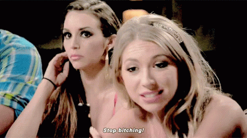 Two Women Are Sitting Next To Each Other And One Of Them Says Stop Bitching GIF