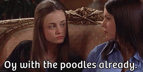 Two Women Are Sitting Next To Each Other On A Couch And One Of Them Is Talking To The Other . GIF