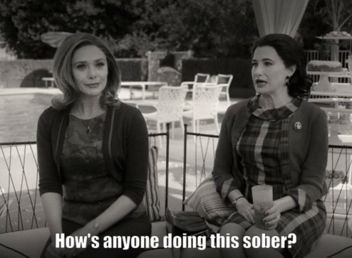 Two Women Are Sitting Next To Each Other With The Words How 'S Anyone Doing This Sober GIF