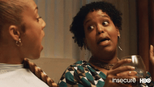 Two Women Are Sitting Next To Each Other With The Words Insecure Hbo On The Bottom Right GIF