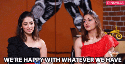 Two Women Are Sitting Next To Each Other With The Words We 'Re Happy With Whatever We Have GIF