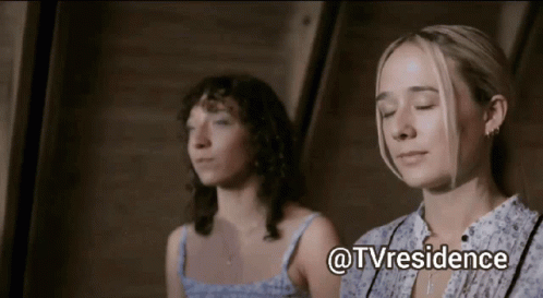 two women are sitting next to each other with their eyes closed and the words @tvresidence written above them
