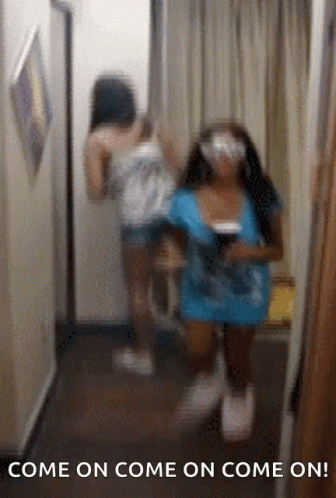 Two Women Are Standing In A Hallway With The Text Come On Come On Come On GIF