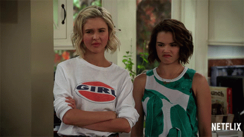 Two Women Standing One Wearing Girl Shirt GIF