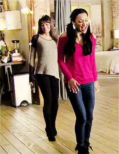 Two Women Are Standing Next To Each Other And One Is Wearing A Pink Top GIF