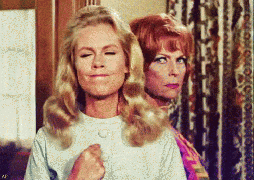 Two Women Are Standing Next To Each Other And One Of Them Is Making A Funny Face GIF
