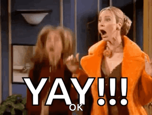 Two Women Are Standing Next To Each Other And One Of Them Says Yay Ok GIF