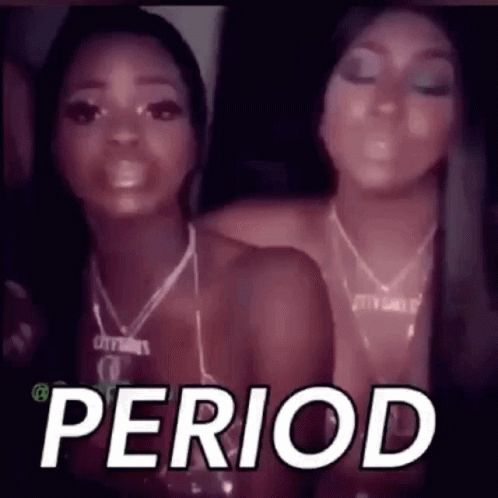 Two Women Are Standing Next To Each Other In A Dark Room And The Word Period Is On The Screen . GIF