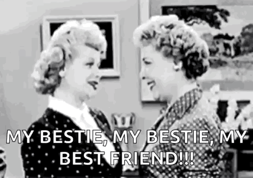 Two Women Are Standing Next To Each Other In A Living Room And Talking To Each Other . GIF