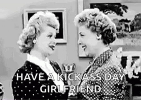Two Women Are Standing Next To Each Other In A Living Room And Talking . GIF