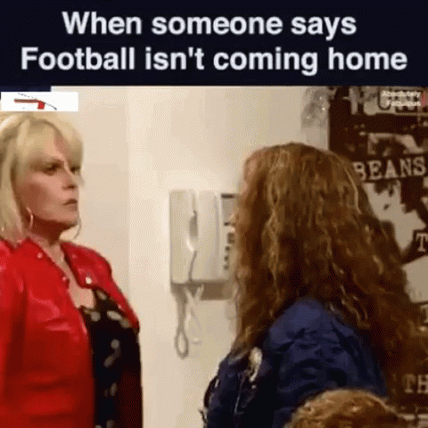 Two Women Are Standing Next To Each Other In A Room And Talking To Each Other . GIF