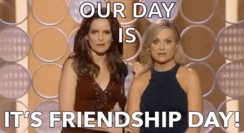 Two Women Are Standing Next To Each Other On A Stage With A Microphone . GIF