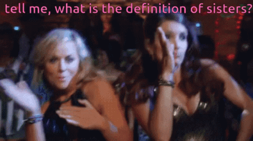 Two Women Are Standing Next To Each Other With The Words Tell Me What Is The Definition Of Sisters Behind Them GIF
