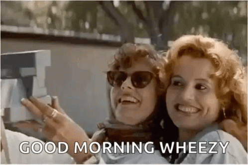 Two Women Are Taking A Selfie With A Polaroid Camera And Smiling . GIF