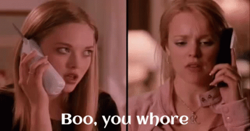 Two Women Are Talking On Cell Phones And One Of Them Says Boo You Whore . GIF