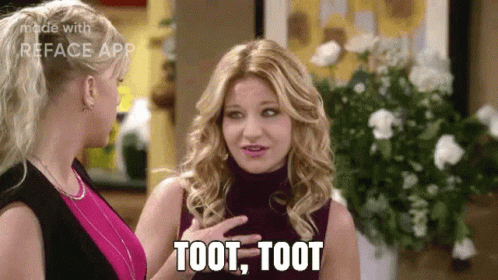 Two Women Are Talking To Each Other And One Of Them Is Saying Toot , Toot GIF
