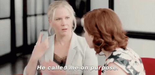 Two Women Are Talking To Each Other And One Of Them Says `` He Called Me On Purpose . '' GIF