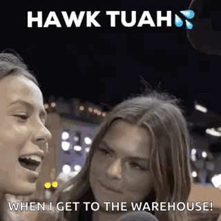 Two Women Are Talking To Each Other In Front Of A Microphone With The Words `` Hawk Tuah '' Written Above Them . GIF