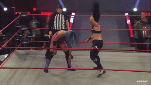 Two Women Are Wrestling In A Ring With A Referee And The Word Impact On The Ring GIF
