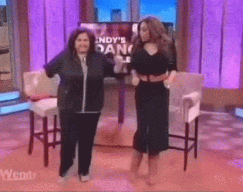 Two Women Dancing by TV With Indy's Dance