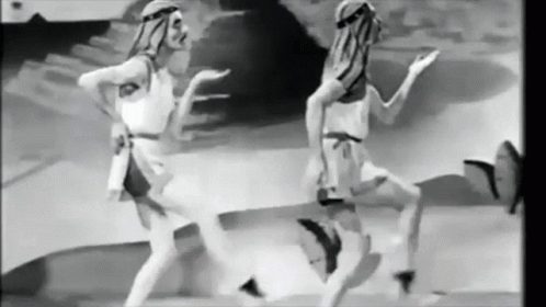 Two Women Dancing In Black And White Desert GIF
